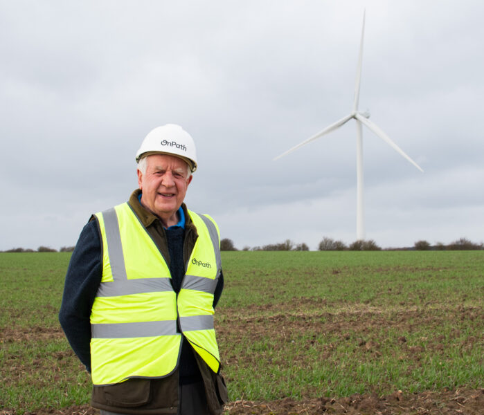 Man smiling on wind farm